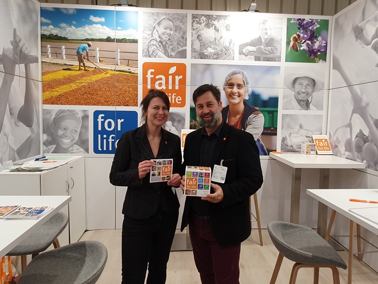 Laurent Lefebvre and a colleague at a conference promoting Fair for Life and For Life in their booth