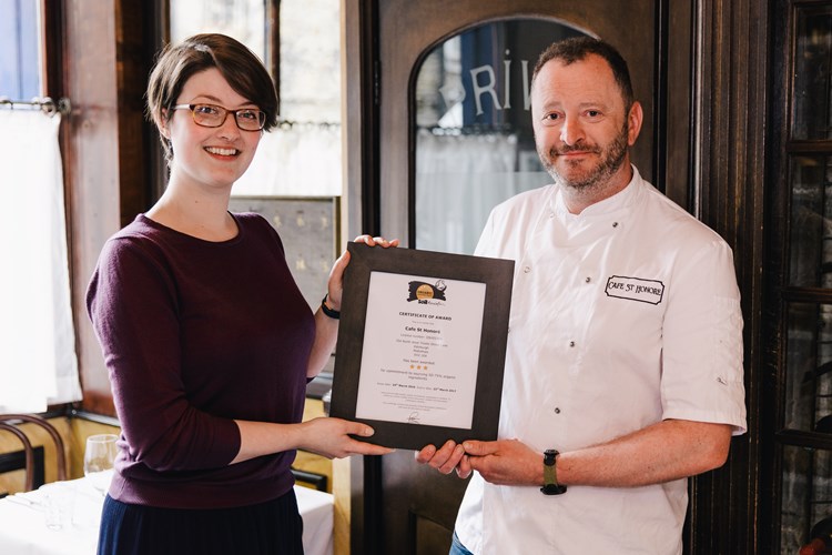 Alison Muirhead (Soil Association) presenting Neil Forbes (Cafe St Honore) with the Organic Served Here 3-star award.